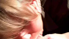 An amateur gives a deepthroat face fucking blowjob in a car