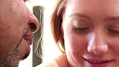 Beautiful blonde with a nice ass enjoying a hardcore interracial fuck on her bed