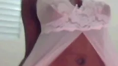 Slim hottie in thong strokes her body in front of a webcam