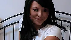 Brunette hussy can't help but moan while toying her pussy