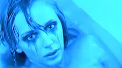 Blonde bombshell poses for the cam in her golden bikini