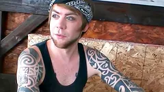 Tattooed punk strokes his dick and cums on his own belly