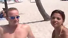 A sizzling redhead Doris is loving it on the beach