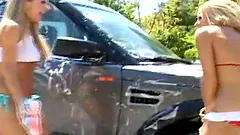 Three awesome blondes make lesbian love after washing a car