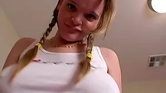 Chubby blonde Kissy plays with her massive tits in front of a webcam