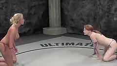 Two blonde lesbians make love during a wrestling match