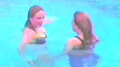 Horny lesbians are kissing in the swimming pool
