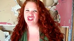 Busty Redhead Sucks a Big Shaft Out Of a Gloryhole in Public