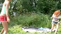 Two slim Russian teens have threesome sex at a picnic
