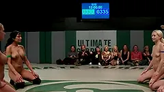 Lustful chicks wrestle in a ring being naked