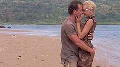 Justine Ashley is with three men on the beach