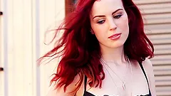 Redhead Alyssa Michelle poses in lingerie in a car