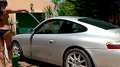Smoking hot chick Venus is washing a damn good car