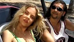 Two men make this sexy chick stun on the beach