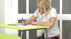 Petite school girl is riding her teacher in class