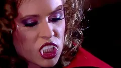 Two vampire chicks toy and finger their asses