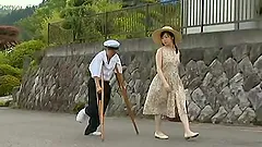 Slutty Japanese chick gets fucked in a village by two dudes
