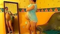 Pregnant brunette shows off her huge belly in homemade clip