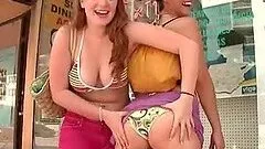 Appealing babes flashing round butts in public