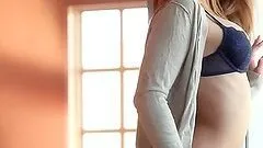 Naked teen stunner fingering her slick pussy