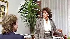 Curly office woman gets fucked on a table in retro video