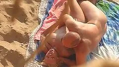 Guy makes love to his cute GF on a beach in front of a hidden cam