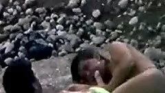 Woman gets her snatch pounded from behind on a beach