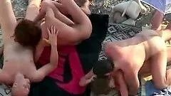 Two horny couples enjoy some naughty banging on a beach