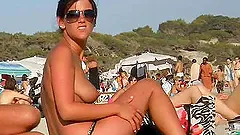 Kinky video of a few people sunbathing and having fun on a nudist beach