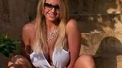 Busty Breann McGregor poses naked outdoors on the stairs