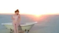 Cute girl Scarlett Keegan takes a bath on a beautiful beach