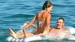 He plays guitar for her and fucks her on the beach