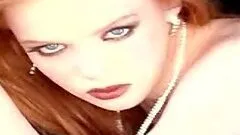 Heather Carolin the redhead hottie poses naked on a bed