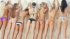 Pretty slim girls pose nude for the cam in a studio