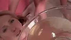 Naked lesbian babe enjoys drinking her piss from a bowl