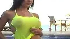 Erika Michelle Barre poses in swimming suit by the pool