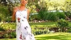 Shiny blondie spreads her legs outside for herself