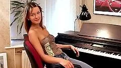 Two nasty girls playing lesbian games near a piano