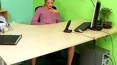Gorgeous blonde secretary toys her pussy in the office