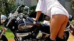 Luscious brunette washes your bike all naked