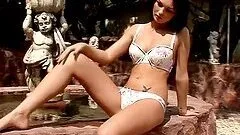 Slender brunette hottie gets naked and rubs her pussy