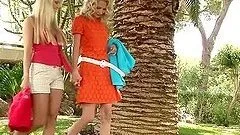 Two sexy blonde girls having lesbian sex outdoors