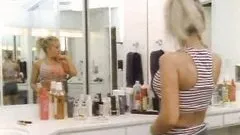 Busty April Adams Stripping and Trying Out Different Sets Of Lingerie