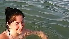 Naturally Busty Brunette Swimming Topless at the Beach