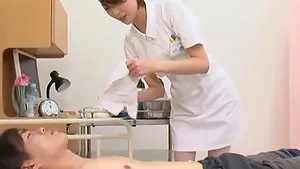 Kinky Asian nurse Makoto Yuuki pleasures a large dick with a BJ