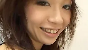 Skinny Asian girl drops on her knees to suck a large penis