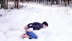 Barefoot Claudia is captured in the cold winter forest