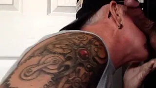 Tattooed oral DILF sucks gloryhole dick