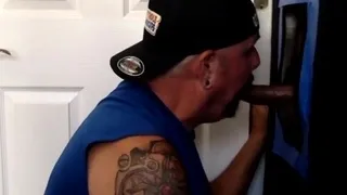 Tattooed gloryhole DILF sucks cock
