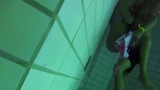 Naughty girl undresses in swimming pool and plays with dick